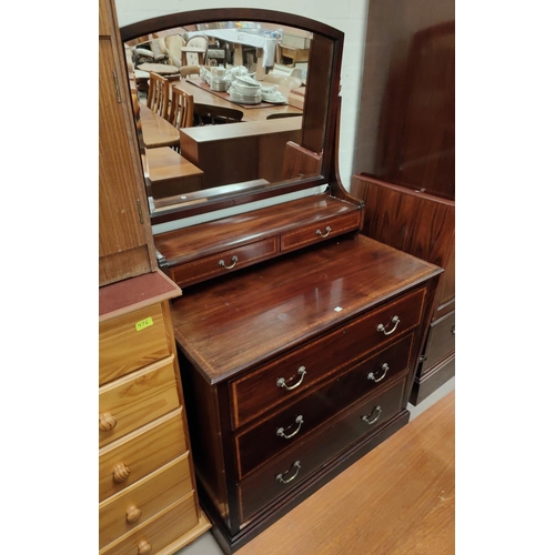 907 - An Edwardian inlaid mahogany wardrobe with mirror door and base drawer; a similar dressing table wit... 