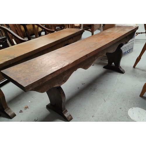 967 - A pair of oak benches in the country manor with revealed construction, and shaped sides, length 137c... 