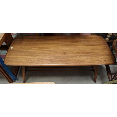 971 - An Ercol coffee table with stick shelf beneath, L104cm