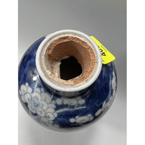 403 - A 19th century Chinese blue and white inverted baluster vase decorated with prunus blossom on branch... 