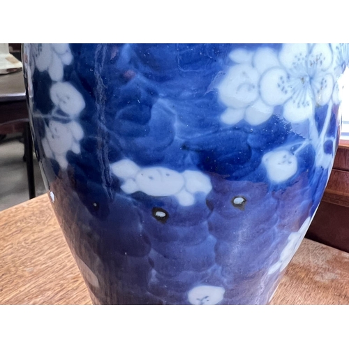 403 - A 19th century Chinese blue and white inverted baluster vase decorated with prunus blossom on branch... 