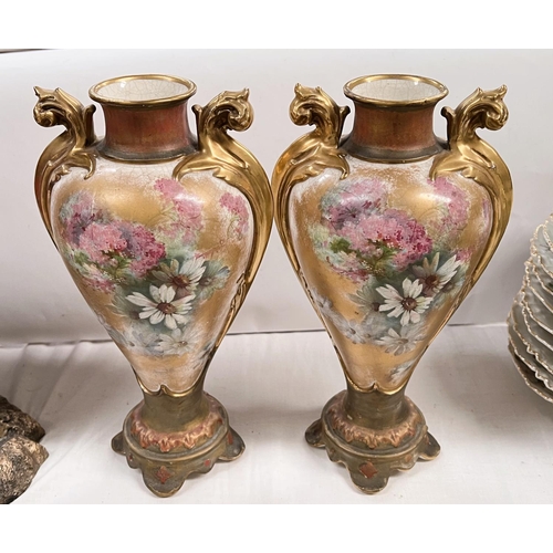 456 - A pair of Victorian tapering ovoid 2 handled vases, hand painted with flowers against a gilt ground,... 