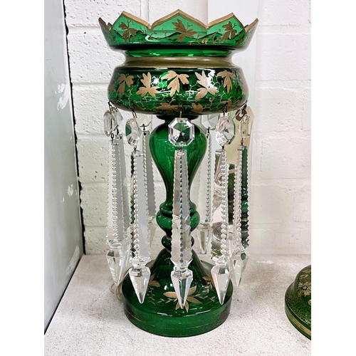 456A - A Victorian green glass lustre with gilt decoration and  serrated faceted drops, ht. 34cm