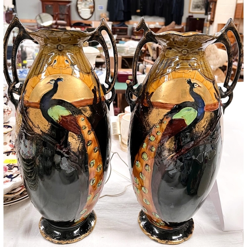 466 - A pair of late 19th century vases decorated with sunrise and peacocks under a lustre glaze height 43... 