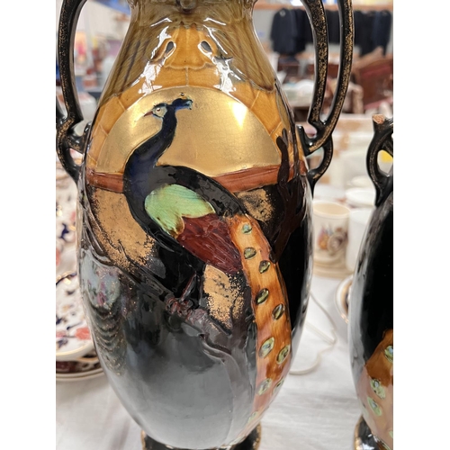 466 - A pair of late 19th century vases decorated with sunrise and peacocks under a lustre glaze height 43... 