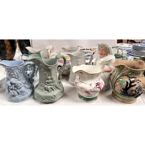 467 - A good selection of 19th century and later jugs, including Masons etc