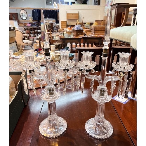 489 - A pair of glass table candelabra; glassware