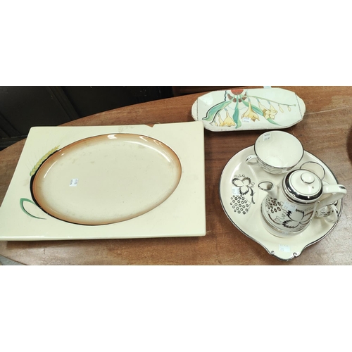 550A - A Clarice Cliff meat platter; a Susie Cooper covered tureen and stand; a 1930's silver lustre  ... 