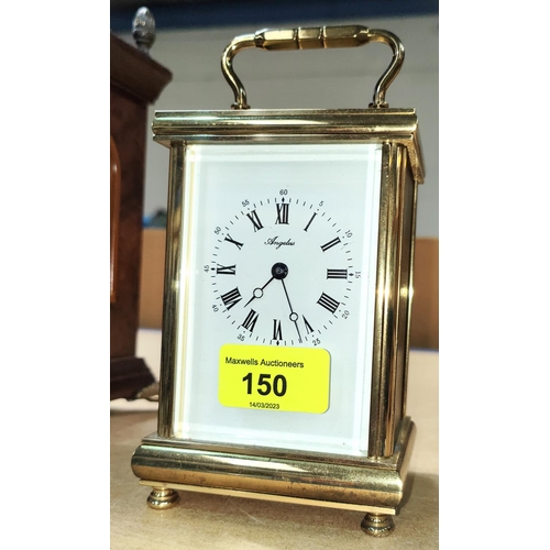 150 - A brass quartz movement carriage clock with bevelled front glass enamel dial