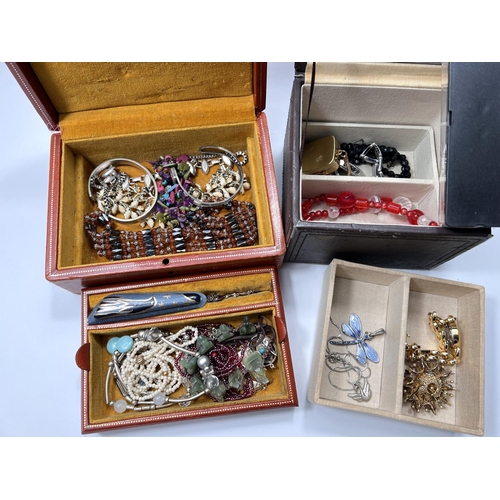 750B - A selection of costume jewellery in four small jewellery boxes including necklaces etc