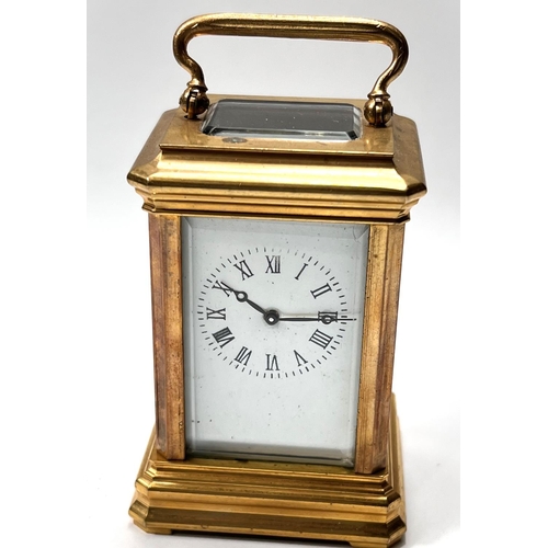 327 - A miniature brass cased carriage clock with time piece movement, ht. 8cm