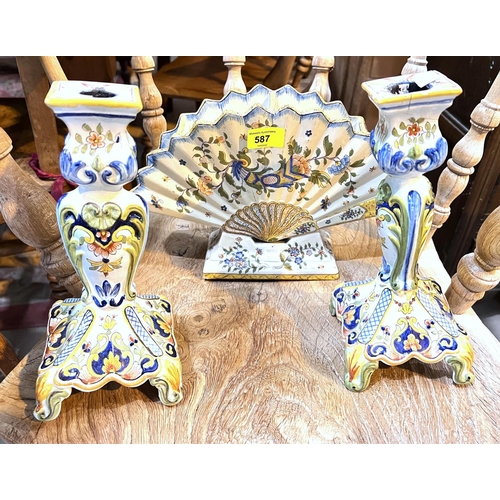 587 - A pair of Italian majolica candle sticks and a similar fan shaped vase (a.f)