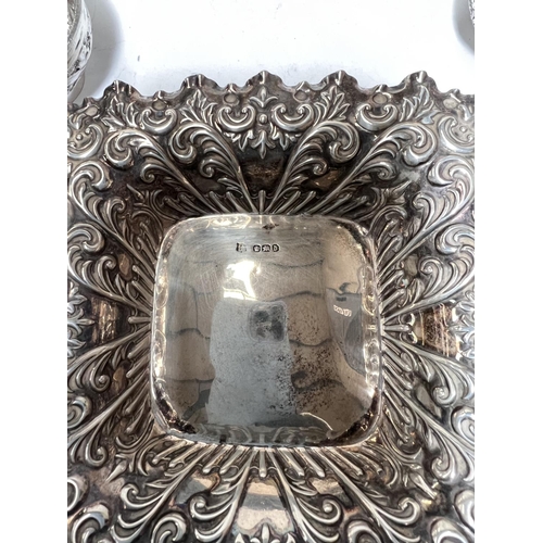 605 - A square hallmarked silver dish with extensive embossed acanthus border, Sheffield 1896 2.2oz and 2 ... 