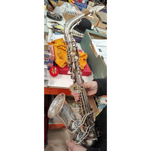 69 - An alto saxophone, cased Conn with Selmer Mouthpiece serial 278584