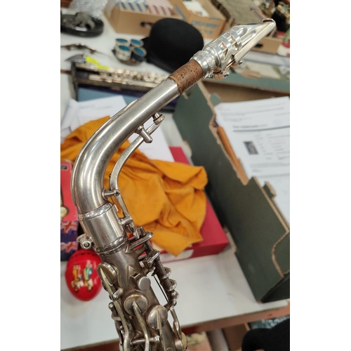 69 - An alto saxophone, cased Conn with Selmer Mouthpiece serial 278584