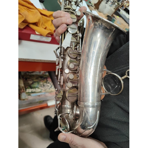 69 - An alto saxophone, cased Conn with Selmer Mouthpiece serial 278584