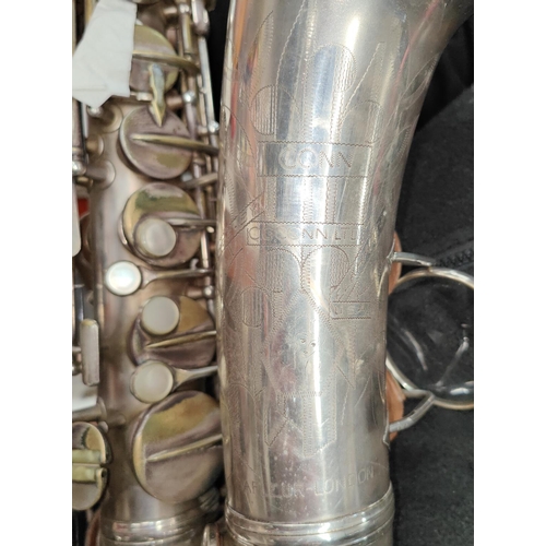 69 - An alto saxophone, cased Conn with Selmer Mouthpiece serial 278584