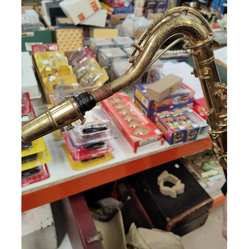 70 - A tenor saxophone and accessories, cased Conn with Selmer mouth piece m250738