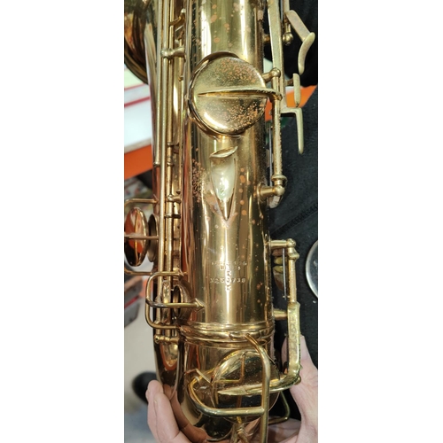 70 - A tenor saxophone and accessories, cased Conn with Selmer mouth piece m250738