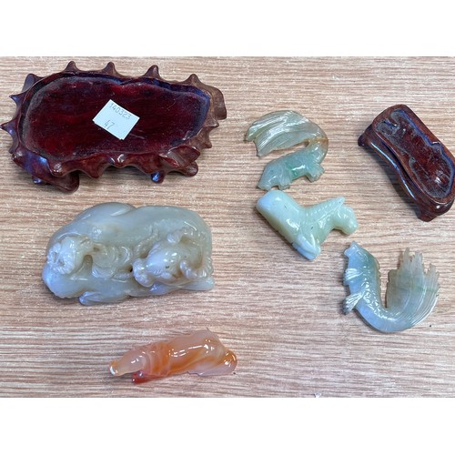 47 - A selection of small Chinese hardstone jade coloured carvings of animals etc some on wooden bases