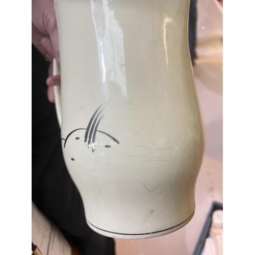 548 - A Susie Cooper large Art Deco jug decorated with rabbits, height 24cm (silvered rim worn); a Susie C... 