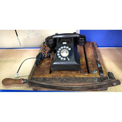 20 - A vintage AEP Bakelite rotary telephone and a vintage wooden guillotine  