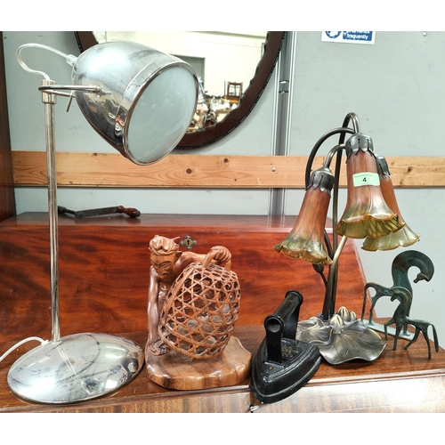4 - A lamp in the form of flower with glass petal shades, a modern desk lamp and a wooden carved group e... 