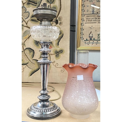 45 - A 19th century silver plated oil lamp with cut glass reservoir and pink glass shade