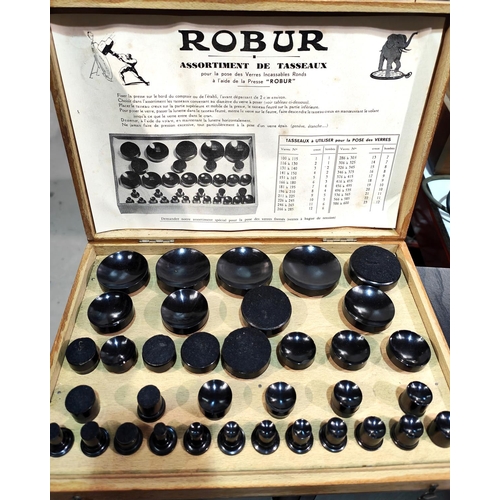 52 - A wooden cased set of Robur Bakelite watch glass fitting dies 35 in total various sizes etc