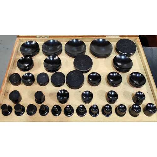 52 - A wooden cased set of Robur Bakelite watch glass fitting dies 35 in total various sizes etc