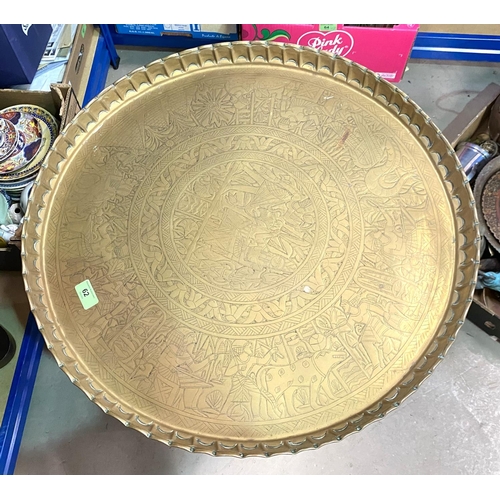 62 - A brass top oriental occasional table; a copper log box and decorative metalware