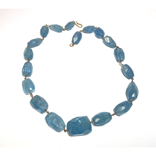 731 - AQUAMARINE, a necklace of graduated faceted beads, approx 370 carat, on yellow metal wire mounts and... 