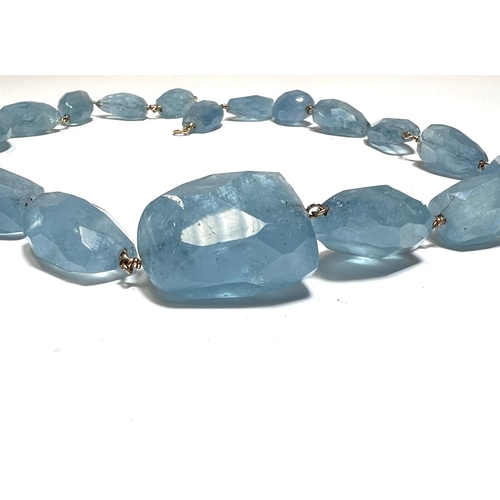 731 - AQUAMARINE, a necklace of graduated faceted beads, approx 370 carat, on yellow metal wire mounts and... 