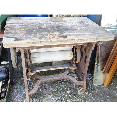 1053 - A cast iron based kitchen table/ mangle