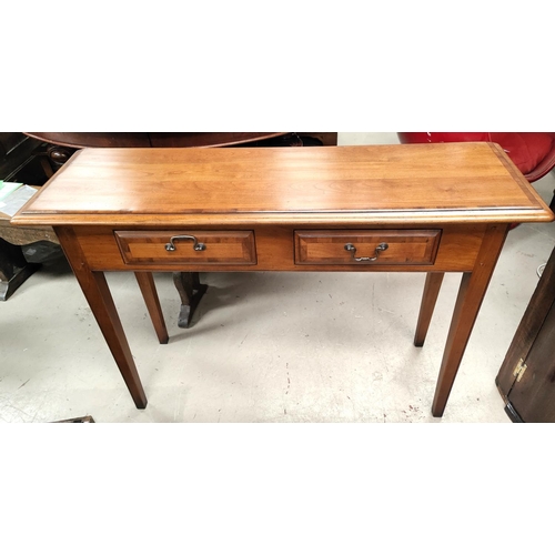 1064 - A Reproduction Regency light wood crossbanded and distressed side/ serving table, with two drawers