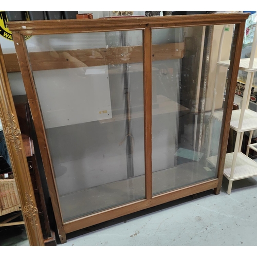 1042 - A oak framed shops/ haberdashery display cabinet with glass shelves, beading and stepped decoration ... 