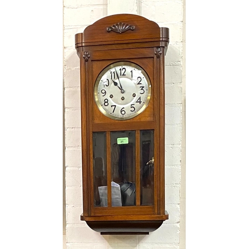 31 - A 1920's chiming wall clock in mahogany case