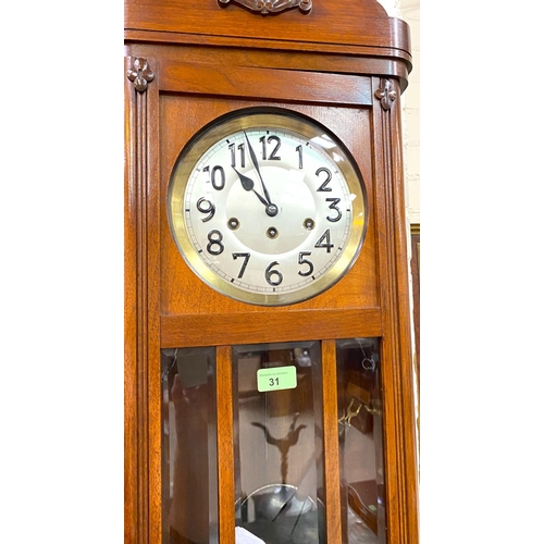 31 - A 1920's chiming wall clock in mahogany case