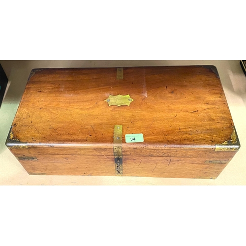 34 - A Victorian brassbound walnut lap desk