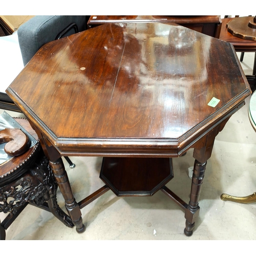 1039 - An Edwardian mahogany octagonal table with turned legs