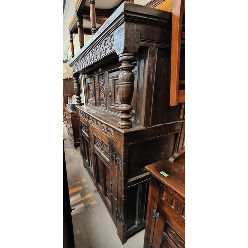 1056 - A late 17th/early 18th century Deudarn with extensive carved decoration, the upper section with twin... 