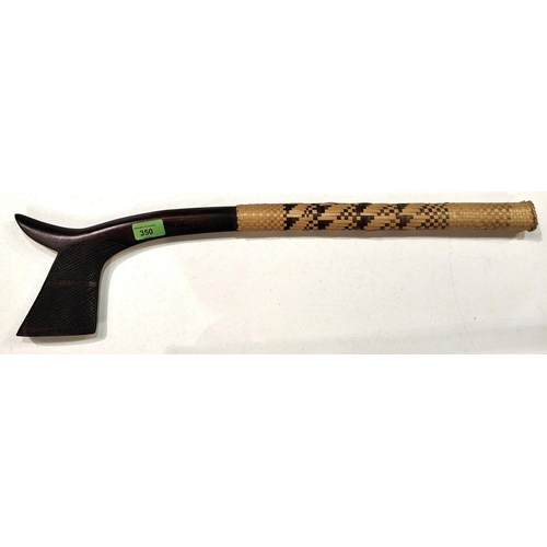 210 - A 20th century Gata style club with split carved head and woven sleeve handle