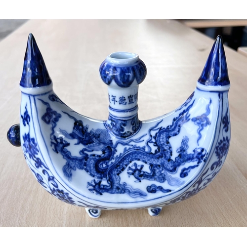 426 - A Chinese blue and white boat shaped 'Pilgrims Flask' decorated with dragon to the body, small bulbo... 