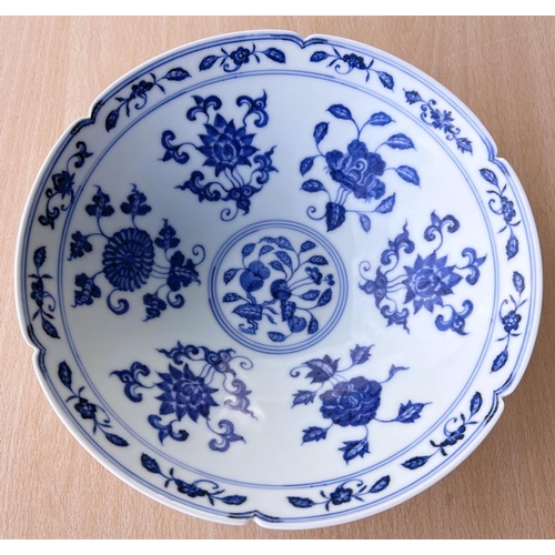 429 - A Chinese blue and white bowl with lobbed rim, floral decoration to the interior a six character mar... 