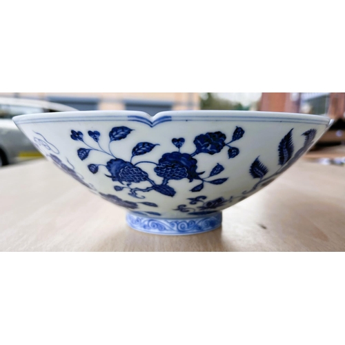 429 - A Chinese blue and white bowl with lobbed rim, floral decoration to the interior a six character mar... 