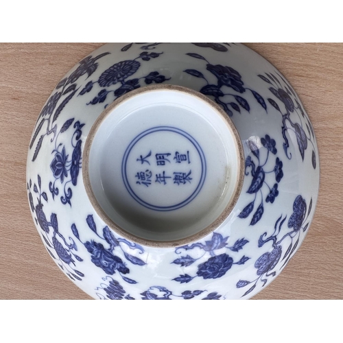 429 - A Chinese blue and white bowl with lobbed rim, floral decoration to the interior a six character mar... 