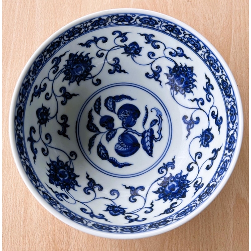 416 - A Chinese blue and white bowl decorated with flowers and fruits etc with six character mark to base,... 