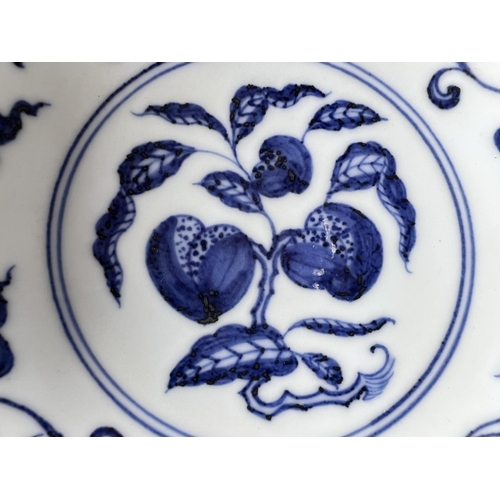 416 - A Chinese blue and white bowl decorated with flowers and fruits etc with six character mark to base,... 