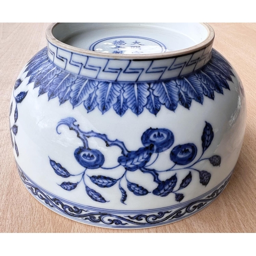 416 - A Chinese blue and white bowl decorated with flowers and fruits etc with six character mark to base,... 