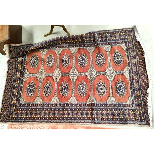 900 - A modern Persian rug, hand knotted, with rust ground, width 127cm